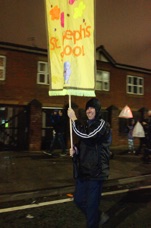 St. Josephs Primary banner, carried by volunteer Awat.jpg